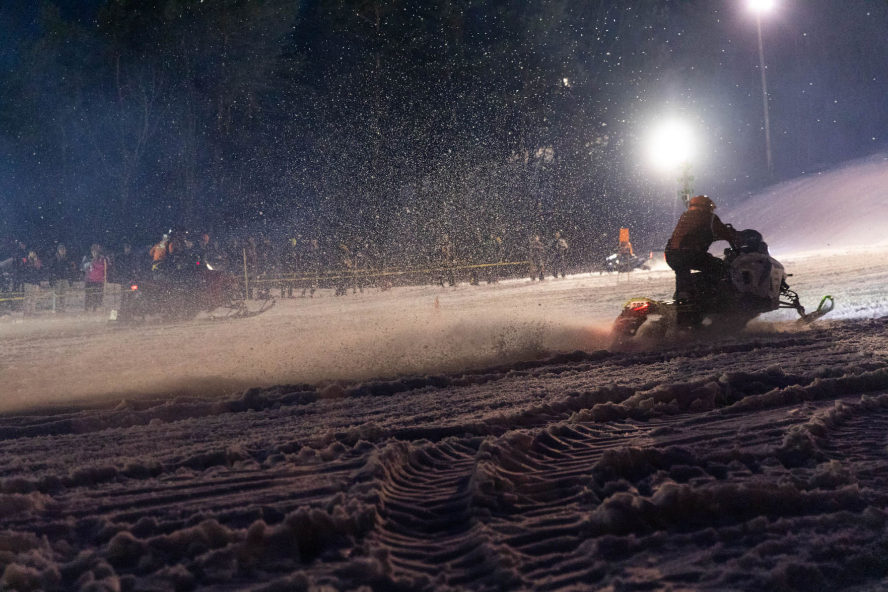 Snowmobile races heat up the night